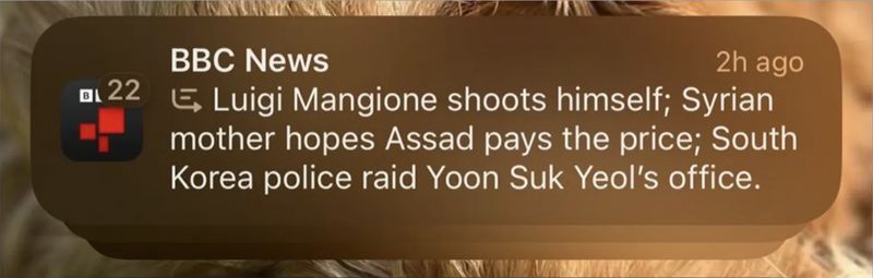 Screenshot of iPhone notification stating Mangione had shot himself